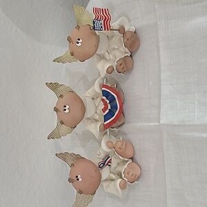 Angel Cheeks Russ Figurines set of three.